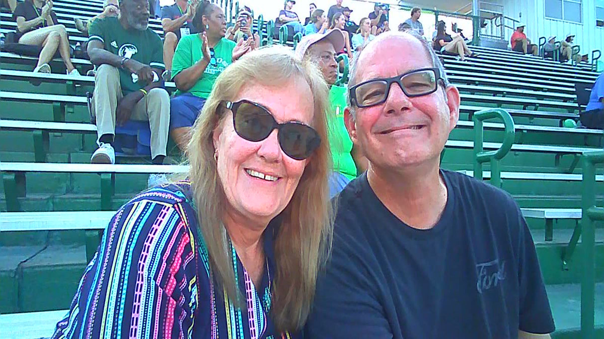 Smiling together in the stands